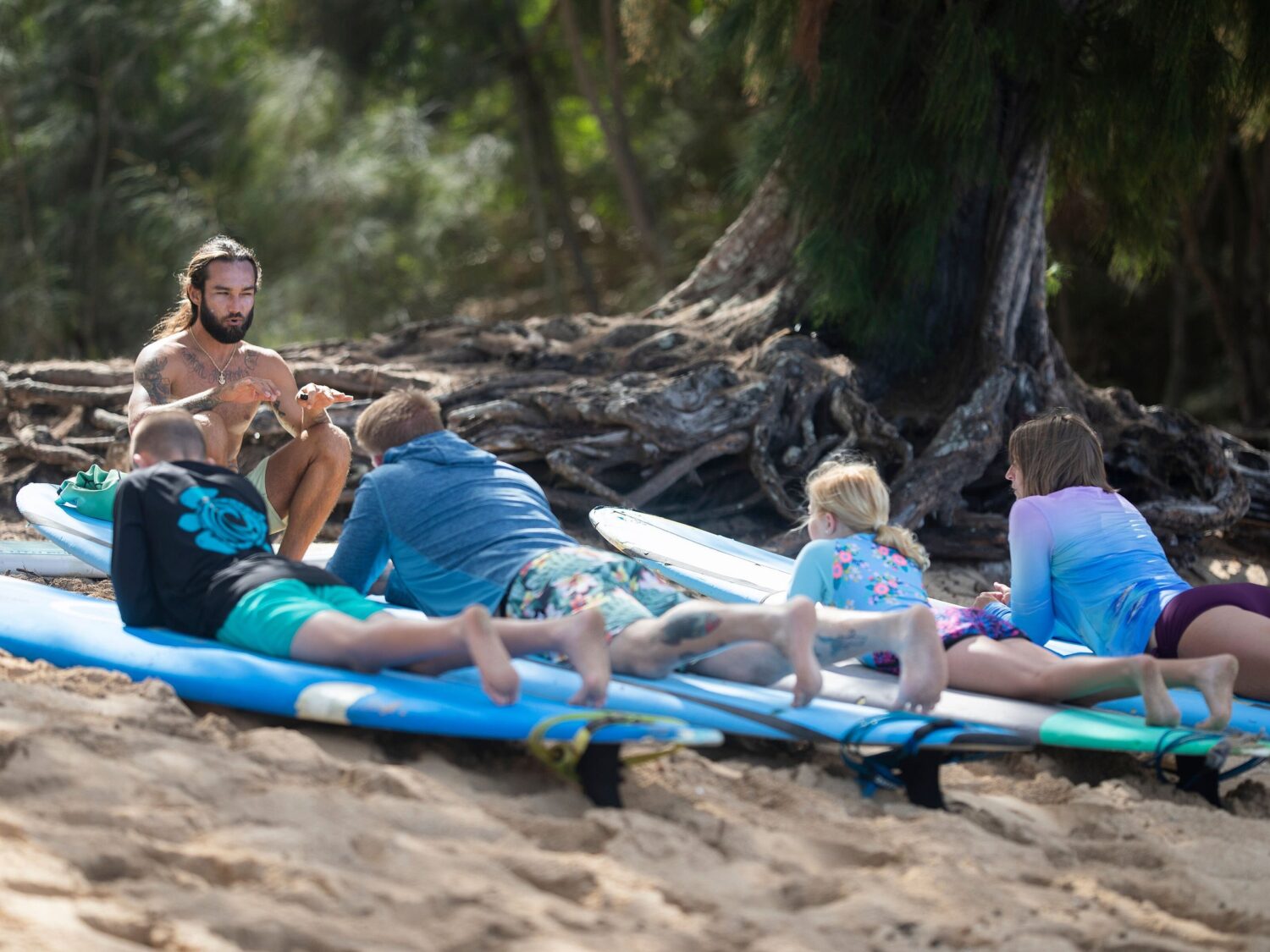 Instructor explaining surf lesson basics on the North Shore of Oahu