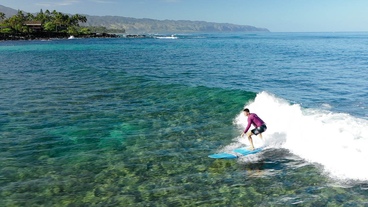 a man riding a wave on top of a body of water